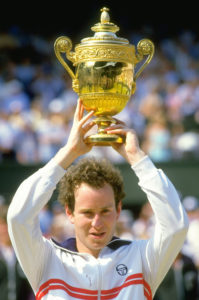 Jul 1984:  John McEnroe of the USA holds the trophy aloft after winning the Lawn Tennis Championships at Wimbledon in London.  Mandatory Credit: Allsport UK /Allsport
